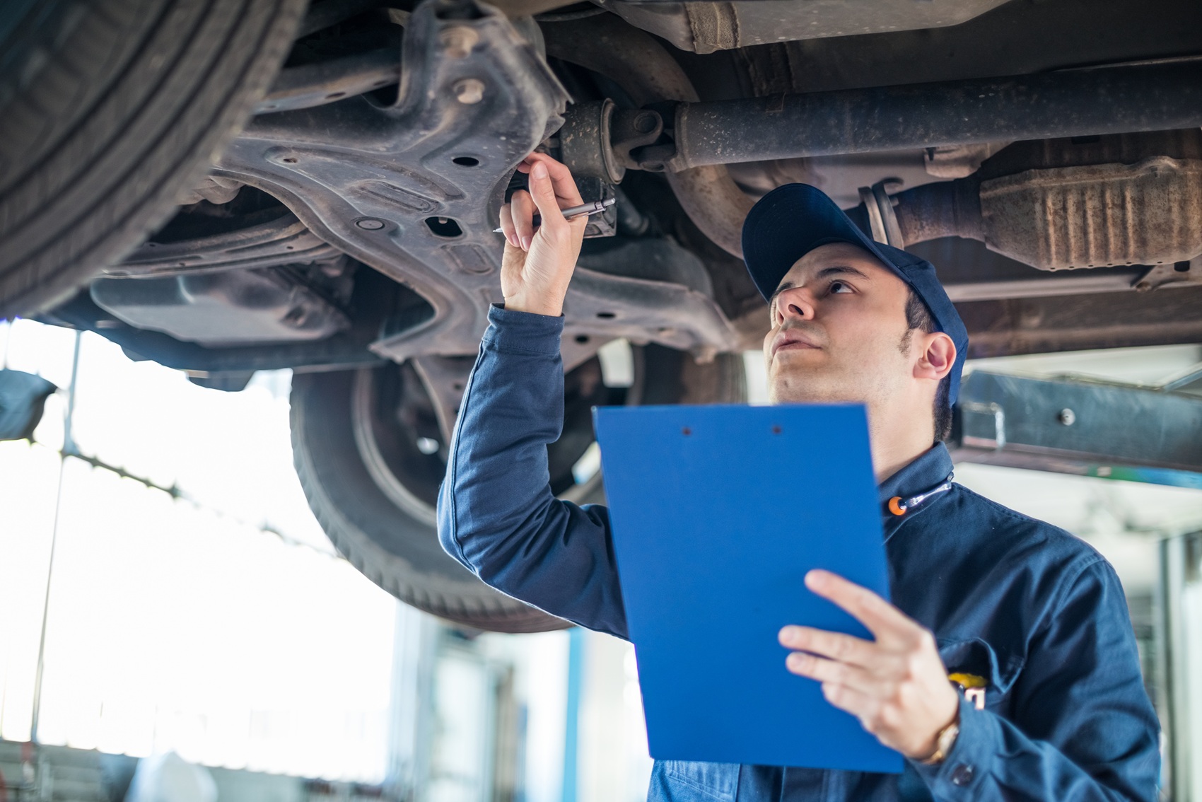 Mechanic inspecting commercial vehicle at Ford Pro Elite service center near Town N Country FL